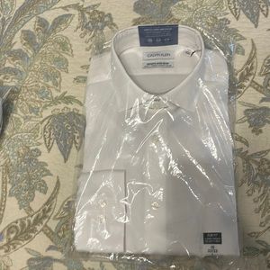 Mens Calvin Klein long sleeve button up. Brand new, never opened.